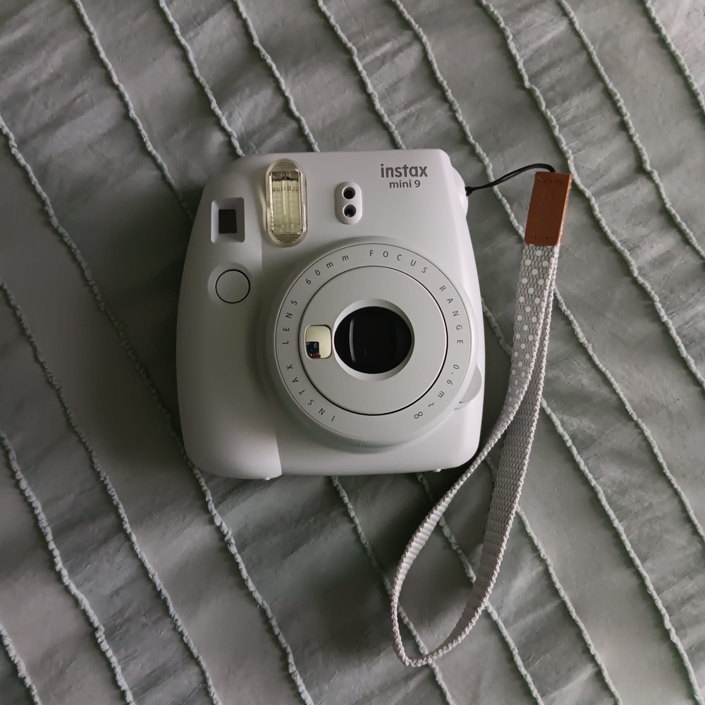 Grey instax model mini 9 with with wrist  lanyard